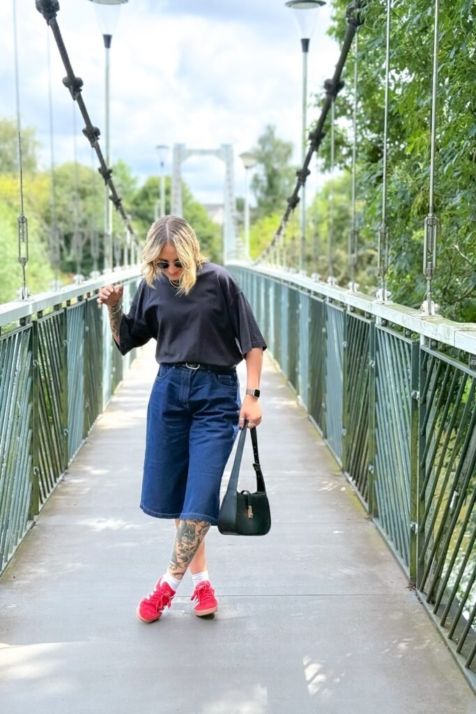 Oversized Black T-shirt + Dark Denim Culottes + Red Sneakers