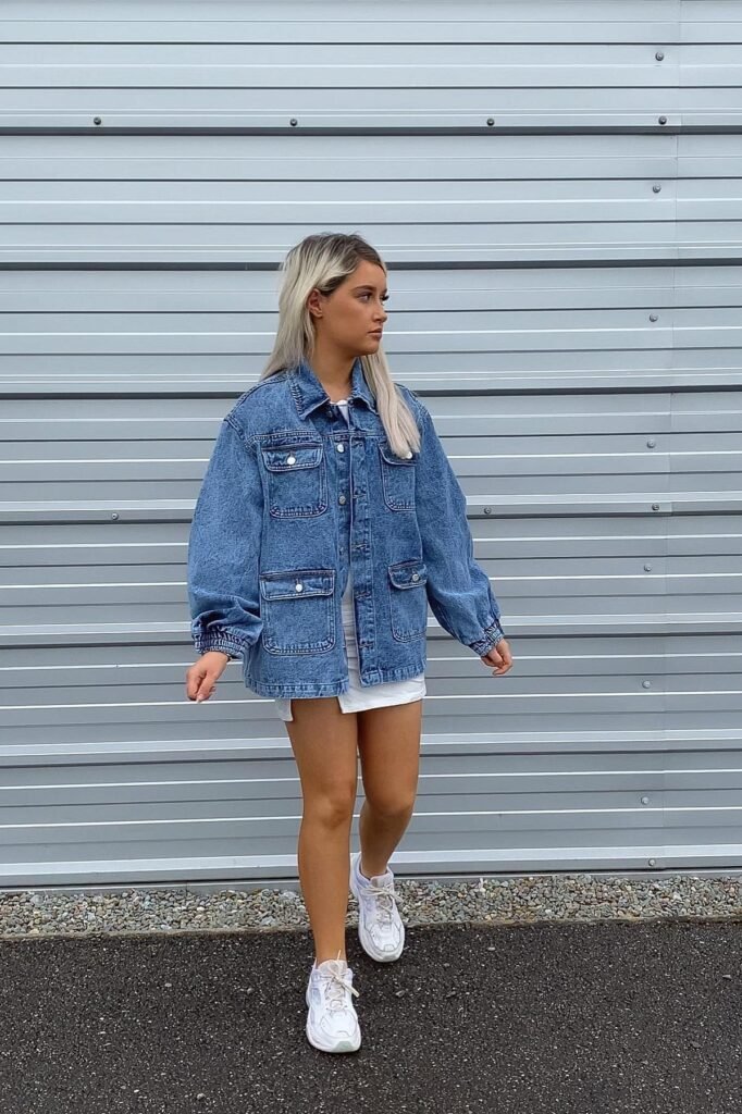 Oversized Denim Chore Jacket + White Mini Dress + White Athletic Sneakers