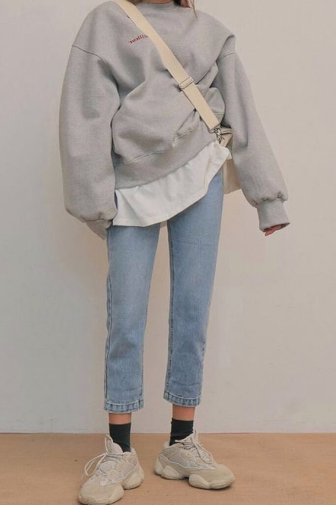 Oversized Grey Sweatshirt + Light Wash Cropped Jeans + Chunky Beige Sneakers