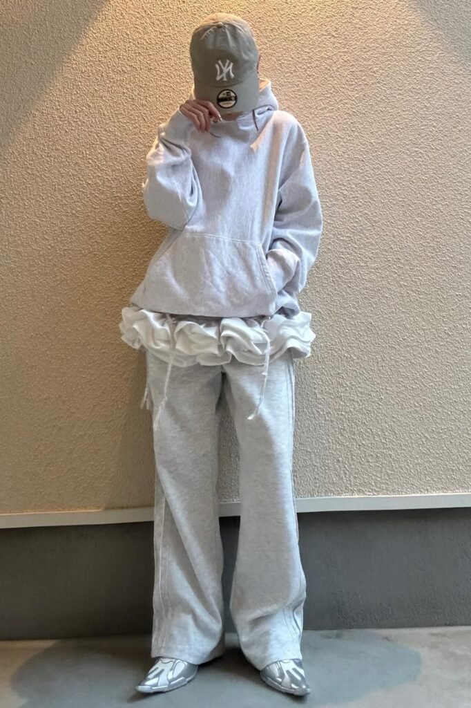Oversized Light Grey Pullover Hoodie + White Ruffled Undershirt + Light Grey Wide-Leg Sweatpants + Silver Pointed-Toe Shoes