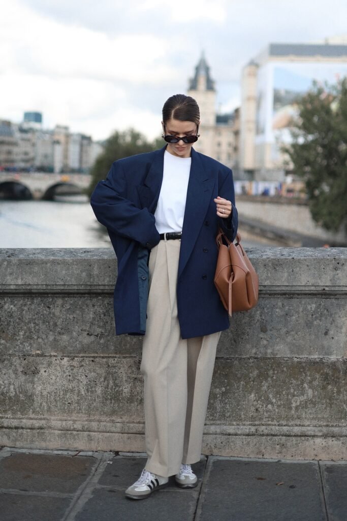 Oversized Navy Blazer + Beige Pleated Trousers + White Athletic Sneakers