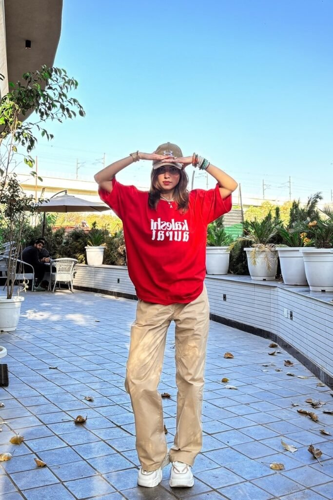 Oversized Red Graphic T-shirt + Khaki Wide-Leg Trousers + White Chunky Sneakers
