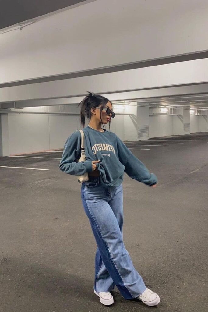 Oversized Teal Graphic Sweatshirt + Two-Tone Patchwork Wide-Leg Jeans + White Sneakers