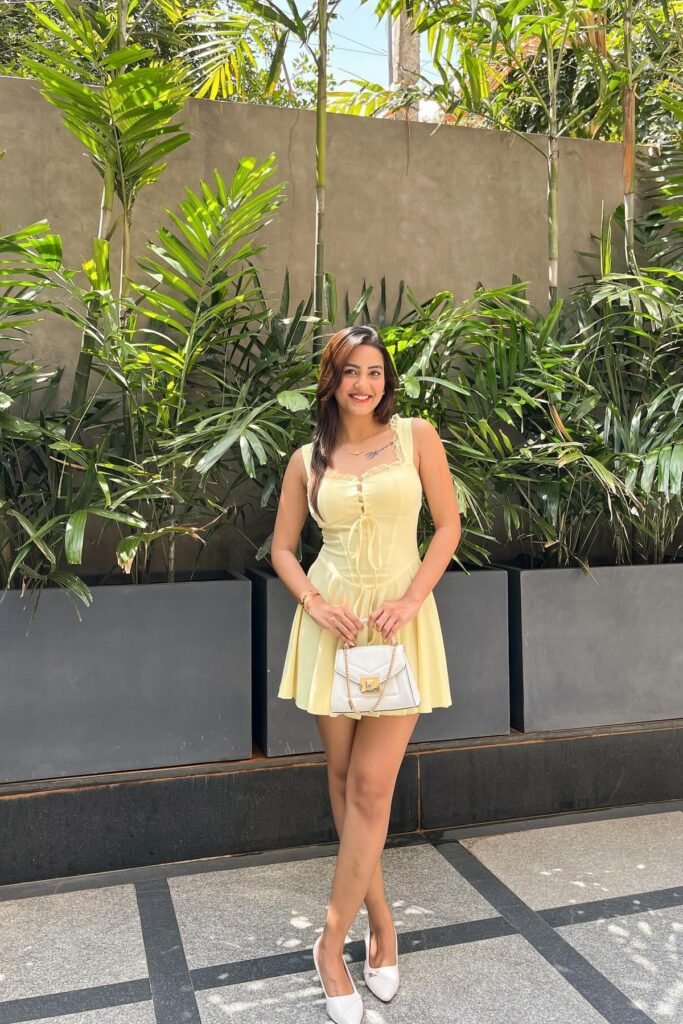 Pale Yellow Corset-Style Mini Dress + White Pointed-Toe Heels + White Quilted Top-Handle Bag