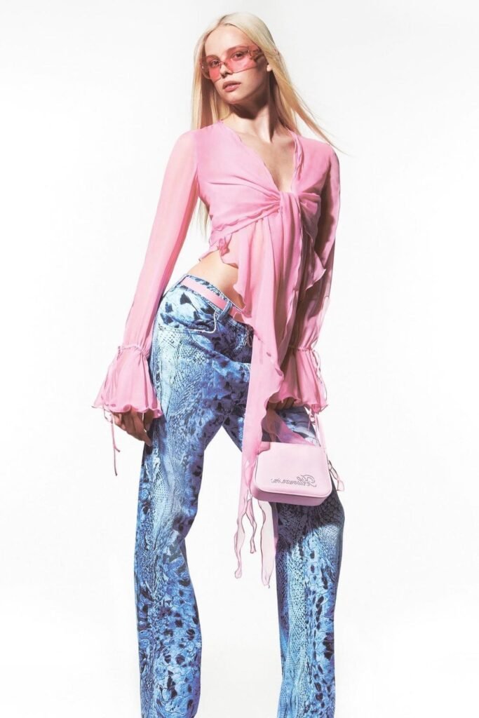Pink Ruffled Tie-Front Blouse + Blue Python Print Flared Jeans + Pink Sunglasses