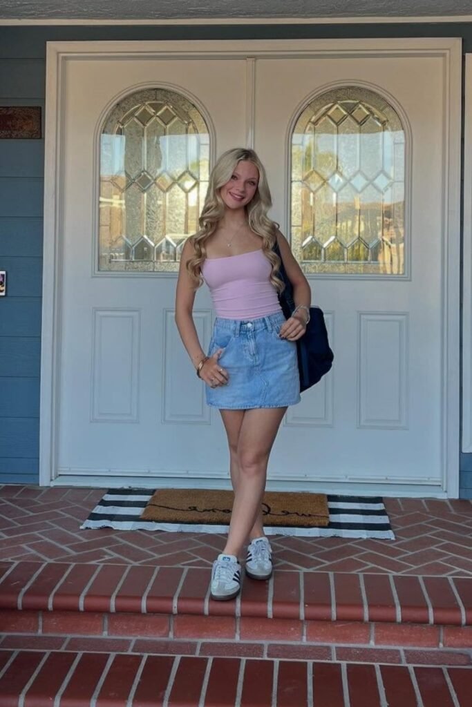 Pink Spaghetti Strap Bodysuit + Light Wash Denim Mini Skirt + Black and White Athletic Sneakers