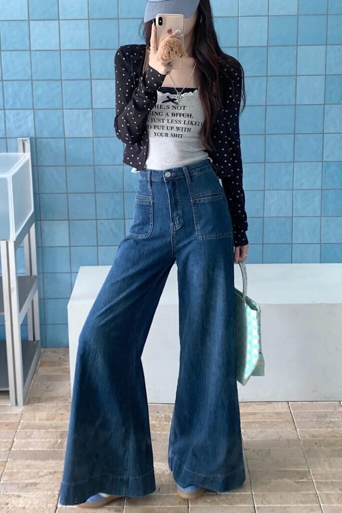 Polka Dot Cardigan over Graphic Camisole + Dark Wash Carpenter-Style Wide-Leg Jeans + Blue and Tan Sneakers