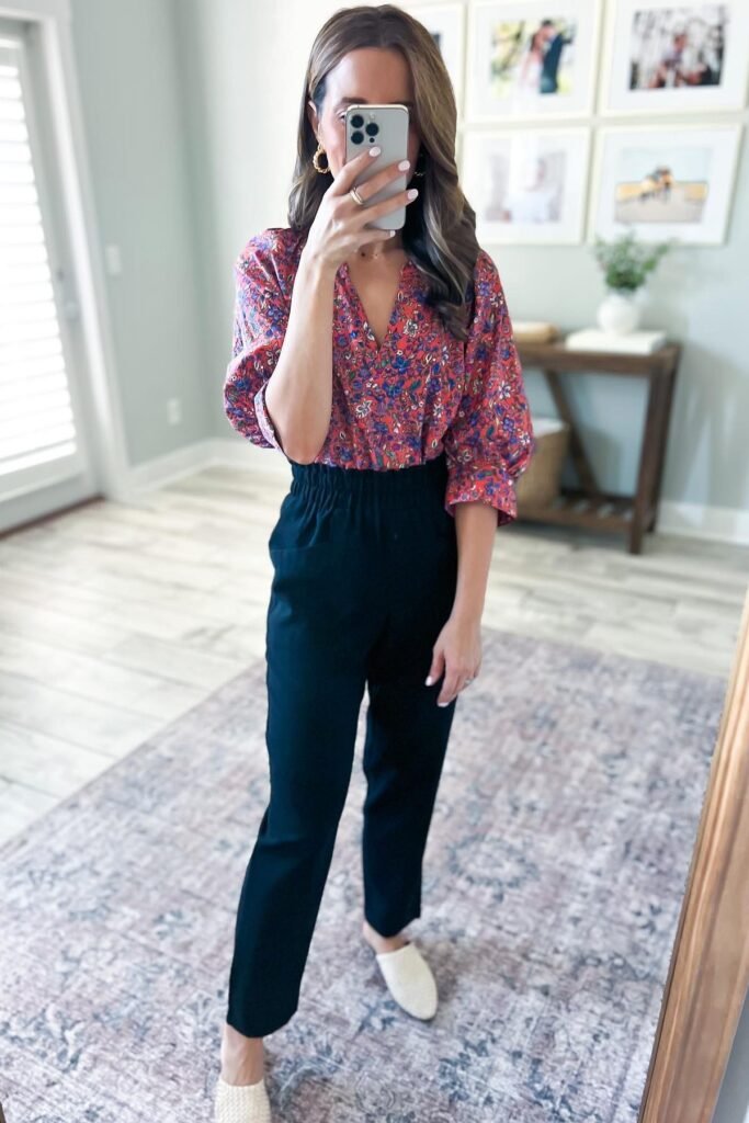 Red Floral V-Neck Blouse + Black High-Waisted Tapered Pants + White Pointed Mules