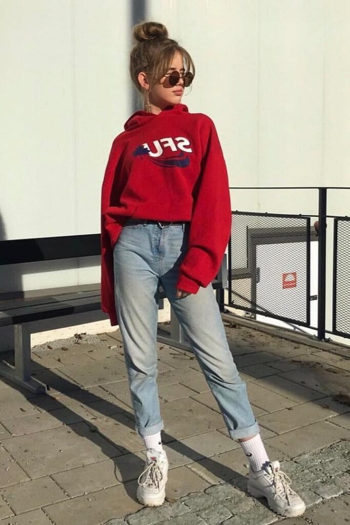 Red Oversized Graphic Hoodie + Light Wash Tapered Jeans + White Athletic Sneakers