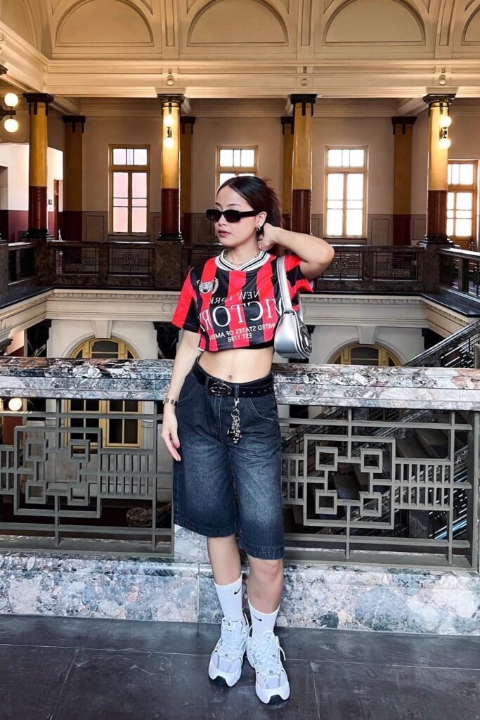 Red and Black Striped Cropped Jersey + Faded Black Denim Shorts + White Chunky Sneakers with White Socks