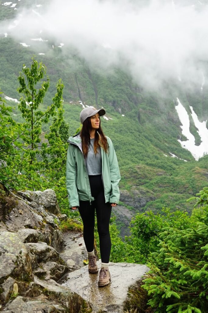 Sage Green Rain Shell + Black Compression Leggings + Brown Leather Hiking Boots