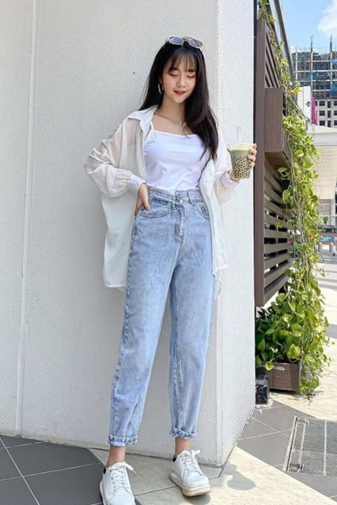 Sheer White Oversized Shirt + White Camisole + Light Wash High-Waisted Jeans + White Sneakers