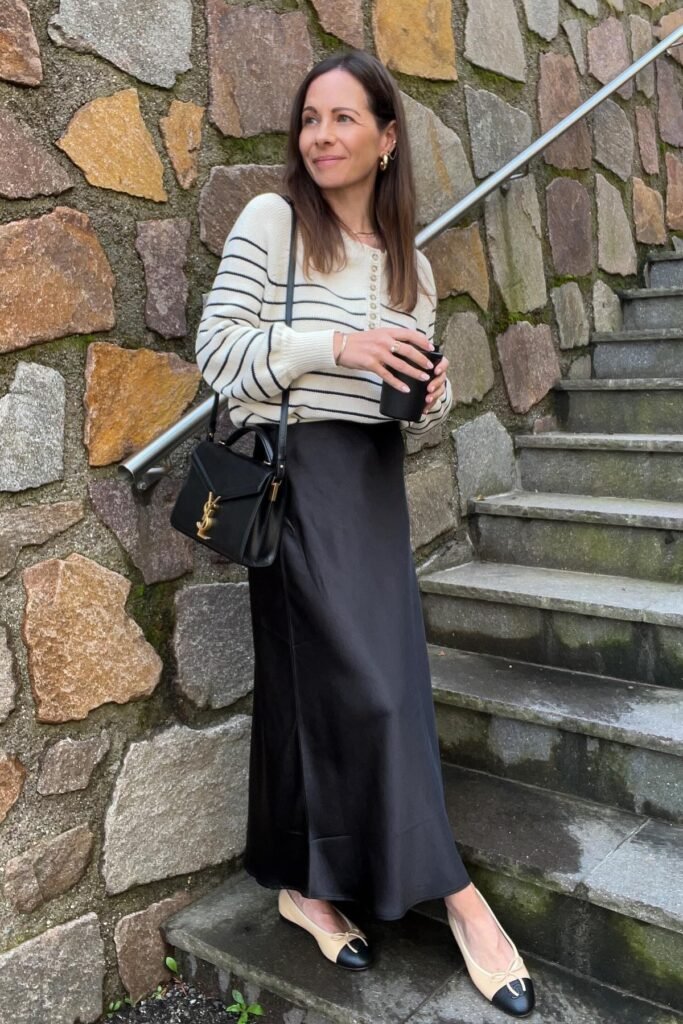 Striped Crewneck Sweater + Black Satin Midi Skirt + Two-Tone Ballet Flats