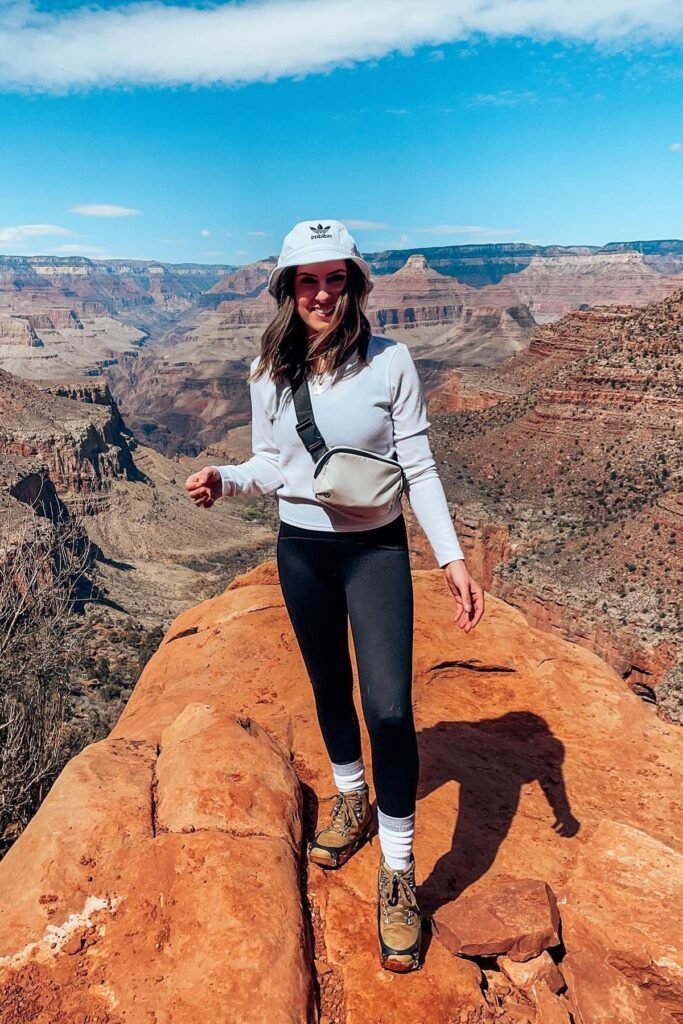 White Bucket Hat + White Long Sleeve Top + Black Leggings + Tan Hiking Boots