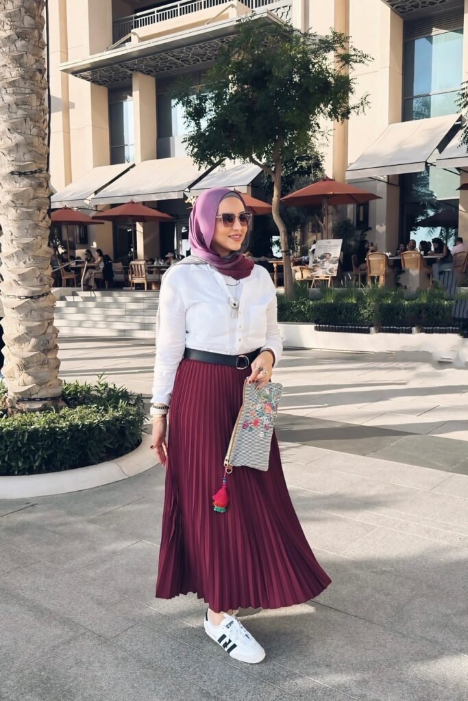 White Button-Down Shirt + Burgundy Pleated Maxi Skirt + White Adidas Sneakers