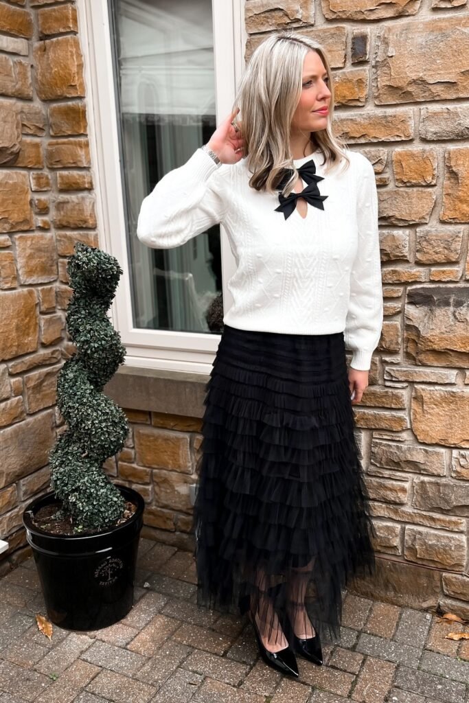 White Cable-Knit Bow Sweater + Black Tiered Tulle Midi Skirt + Black Pointed Pumps
