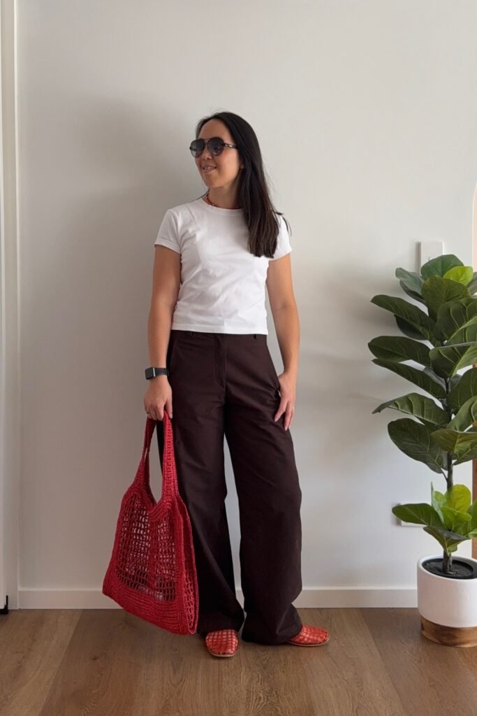 White Classic T-Shirt + Dark Brown Wide-Leg Trousers + Red Mesh Flats