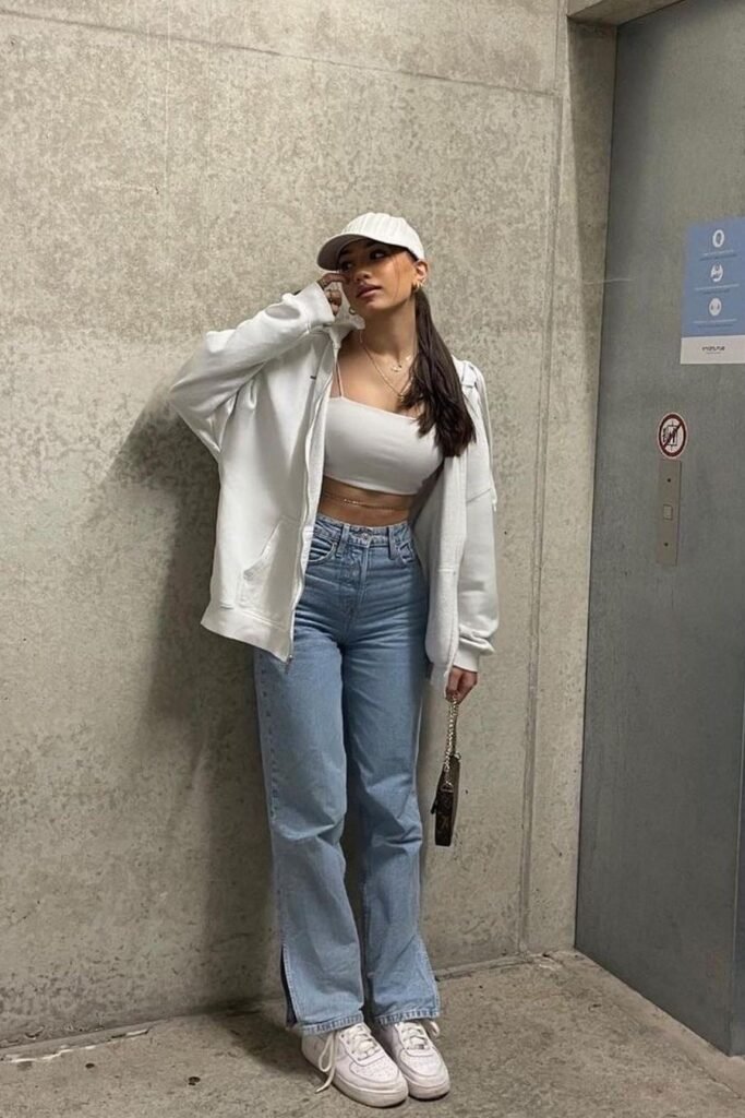  White Crop Top + White Zip-Up Hoodie + Light Wash Jeans with Side Slits + White Sneakers