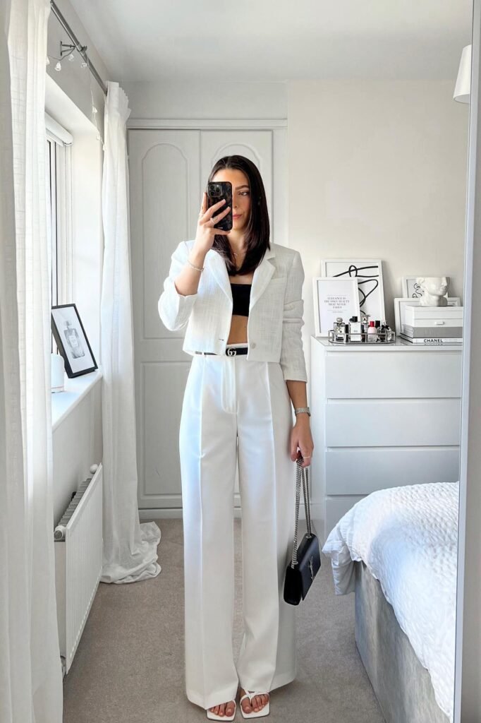 White Cropped Blazer + Black Bandeau Top + White Wide-Leg Trousers + Black Slim Belt + Black Chain Strap Handbag