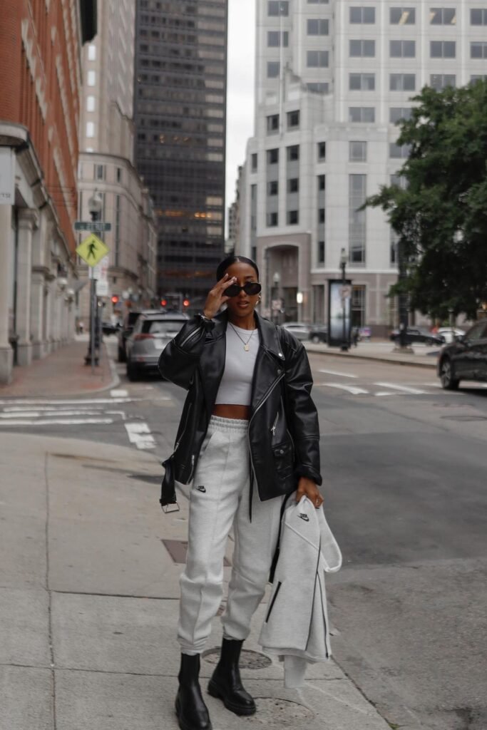 White Cropped Tank Top + Oversized Black Leather Biker Jacket + Light Grey Joggers + Black Chunky Chelsea Boots