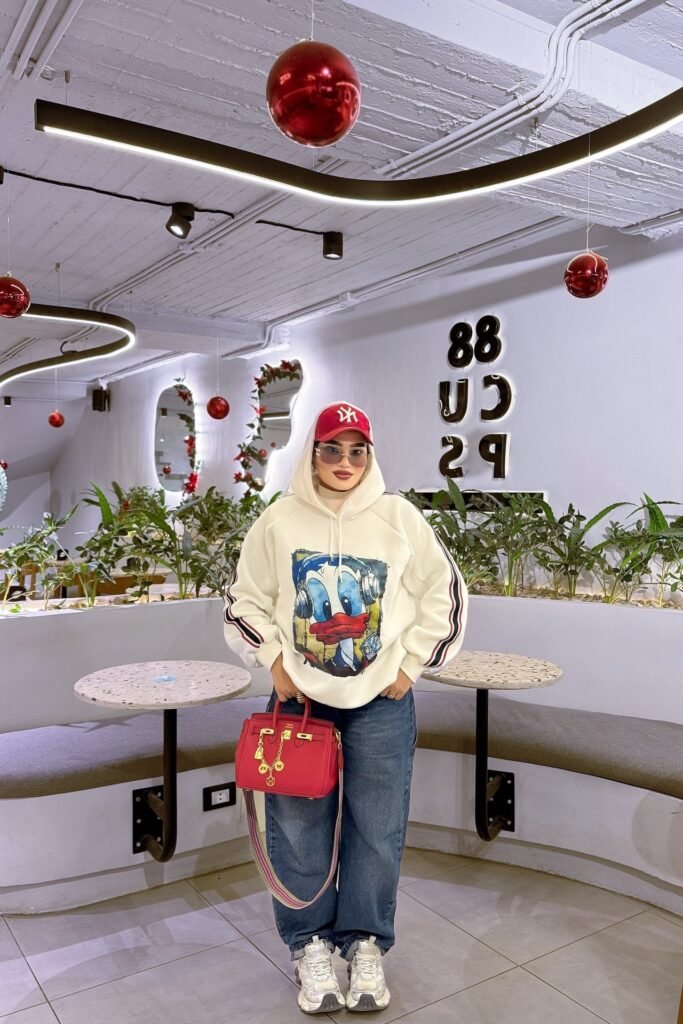 White Donald Duck Graphic Hoodie + Baggy Blue Jeans + White Chunky Sneakers