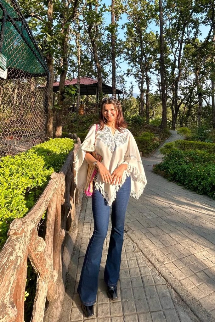 White Embroidered Fringe Poncho + Dark Wash Flare Jeans + Black Square-Toe Boots