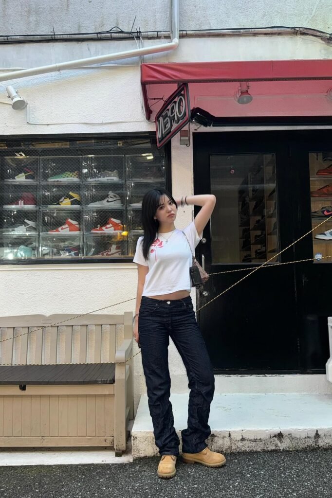 White Graphic T-Shirt + Dark Wash Straight-Leg Jeans + Tan Work Boots