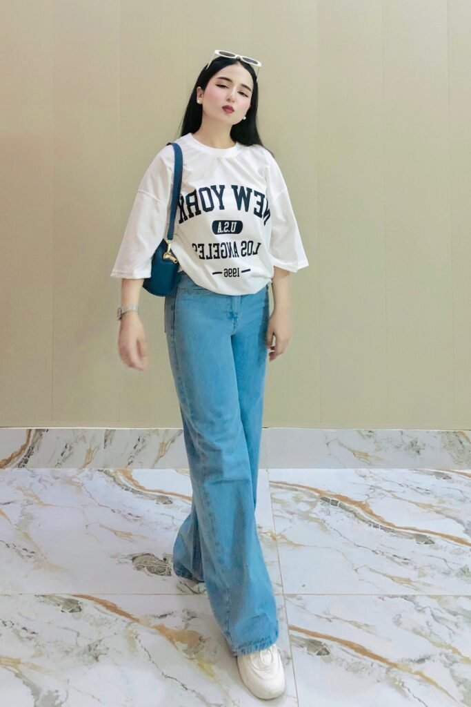 White Graphic T-Shirt + Light Blue Wide-Leg Jeans + White Sneakers