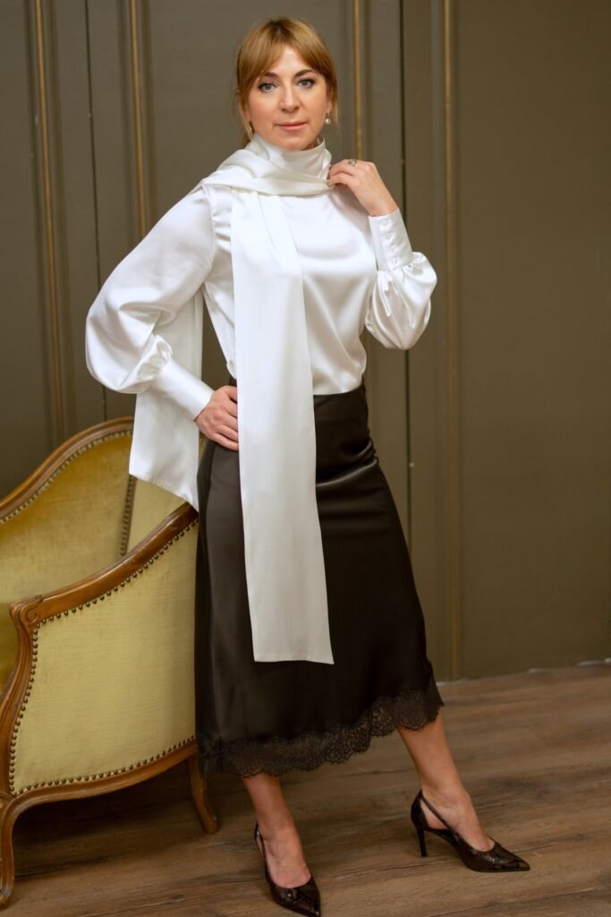 White High-Neck Satin Blouse + Dark Brown Lace-Trim Midi Skirt + Dark Pointed-Toe Pumps