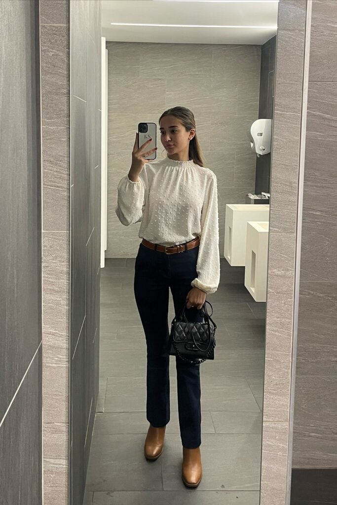 White High-Neck Swiss Dot Blouse + Dark Wash Slim Jeans + Brown Leather Boots