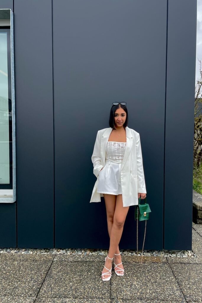  White Lace Corset Top + White Satin Shorts + Oversized White Blazer + White Strappy Sandals