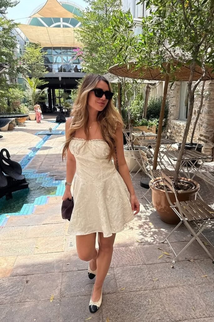 White Lace Mini Dress + Black and White Cap-Toe Ballet Flats + Black Sunglasses