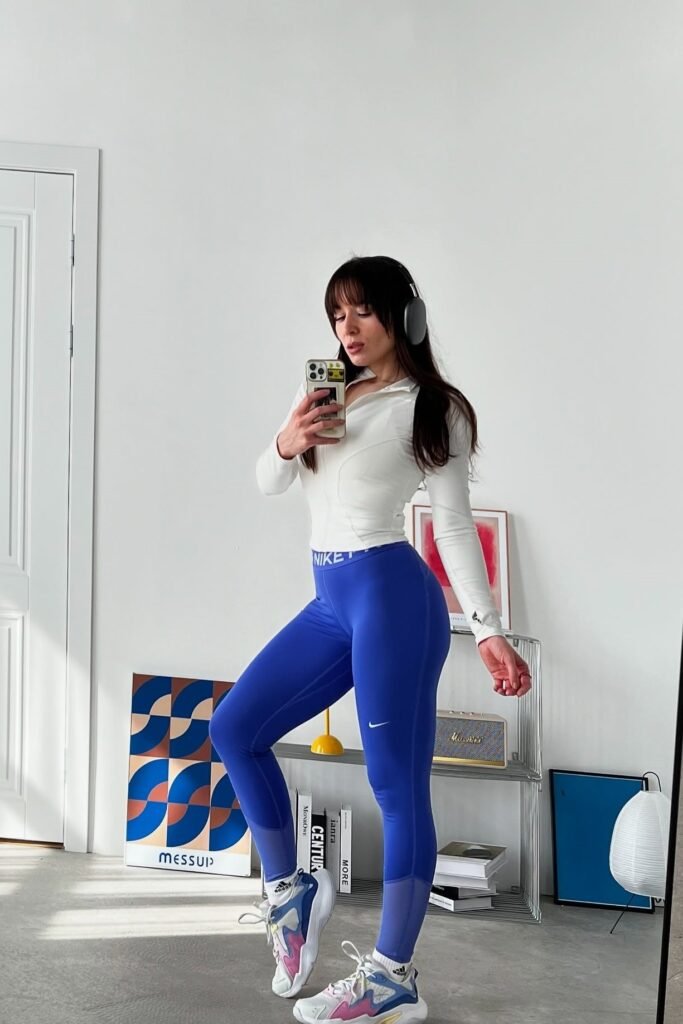 White Long-Sleeve Quarter-Zip Top + Royal Blue Nike Leggings + Multi-Color Chunky Sneakers