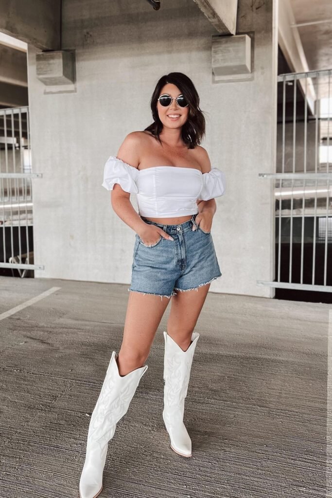 White Off-The-Shoulder Puff Sleeve Top + Mid-Wash Denim Shorts + White Cowboy Boots
