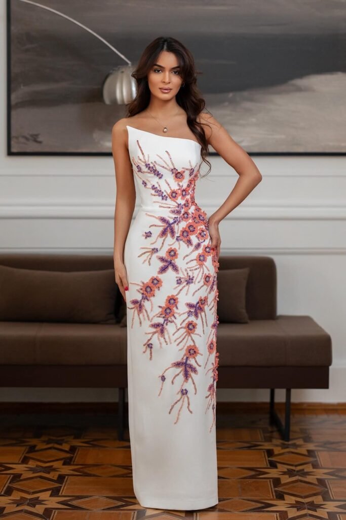 White One-Shoulder Column Gown + Orange and Purple Floral Appliqué + Delicate Pendant Necklace