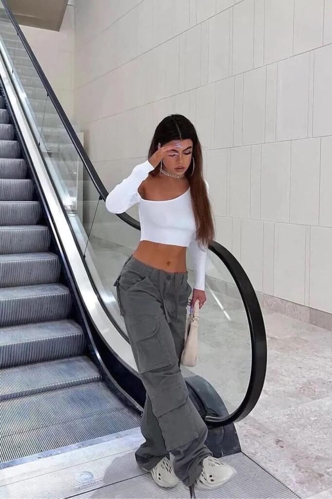 White One-Shoulder Crop Top + Dark Grey Multi-Pocket Cargo Pants + Beige Foam Clogs