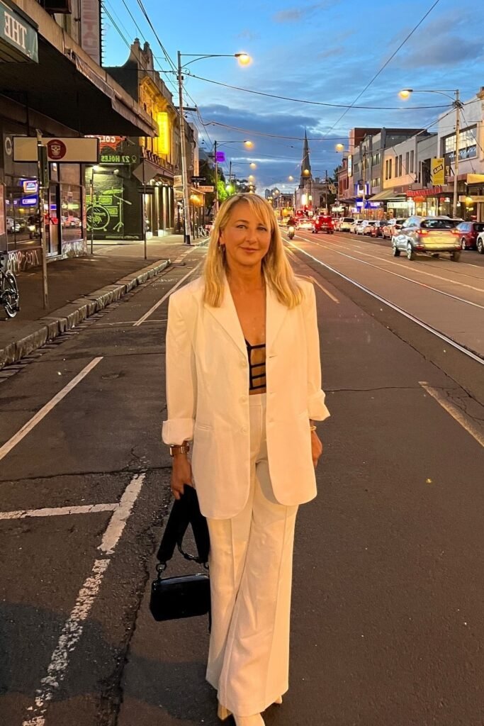 White Oversized Blazer + White Wide-Leg Trousers + Black Cut-out Bodysuit + Black Handbag