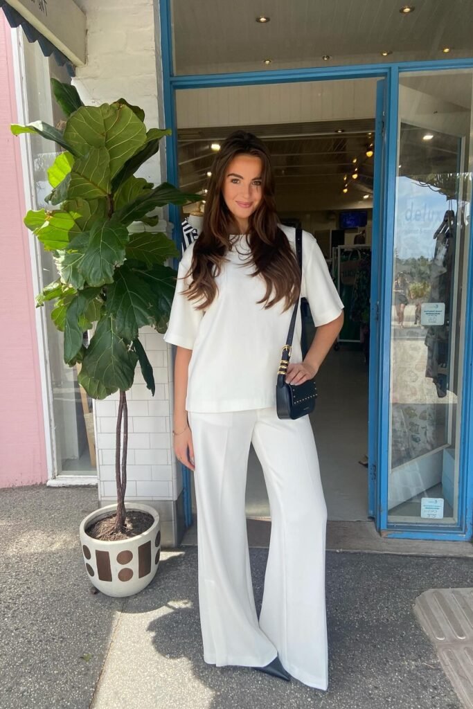 White Oversized Short-Sleeve Top + White Wide-Leg Trousers + Black Pointed-Toe Boots