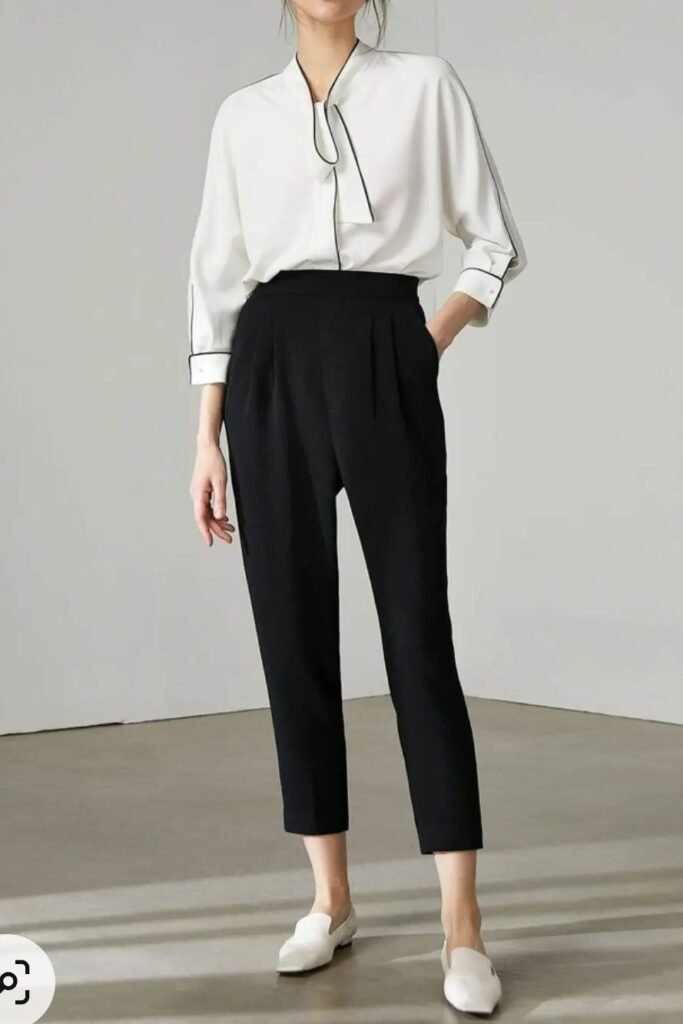 White Piping-Detail Blouse + Black High-Waisted Pleated Trousers + White Loafers