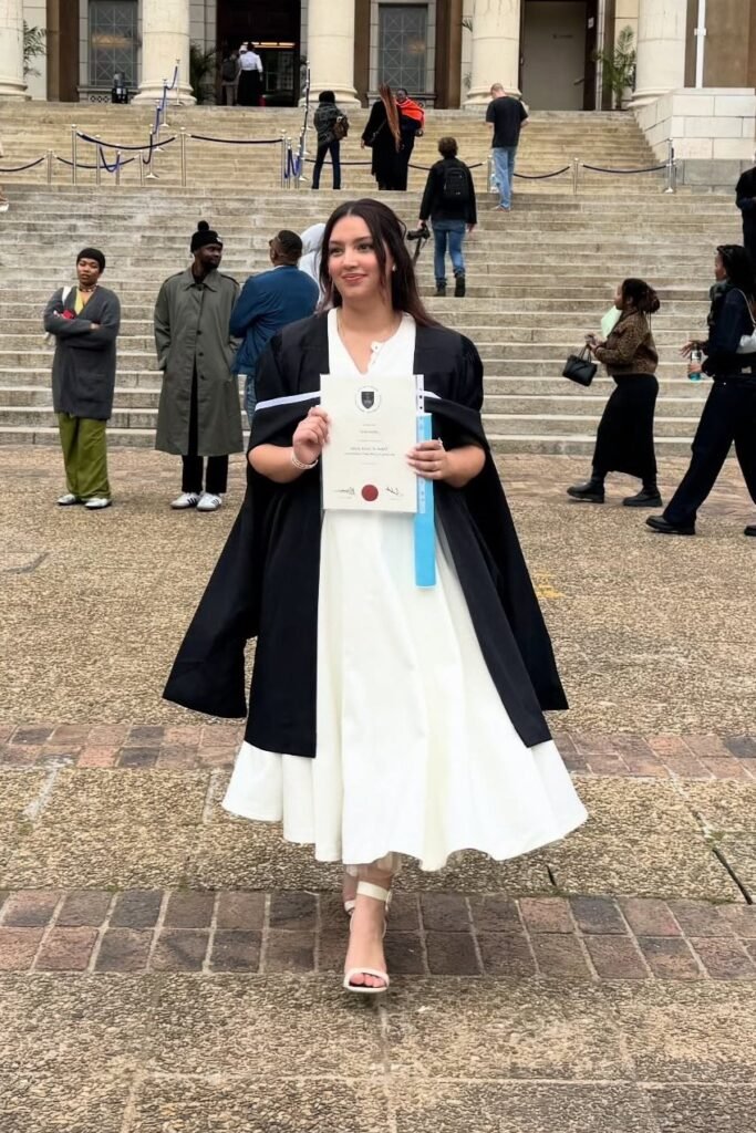 White Pleated Midi Dress + Black Academic Gown + White Ankle-Strap Sandals