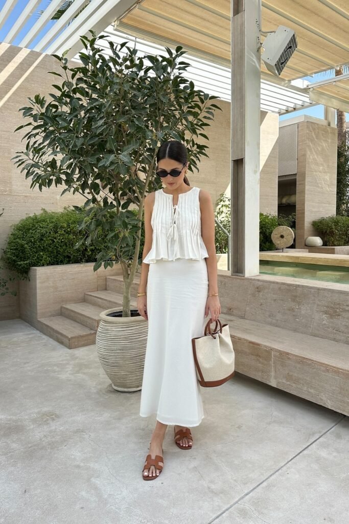 White Pleated Sleeveless Blouse + White Silk Midi Skirt + Brown Leather Slide Sandals