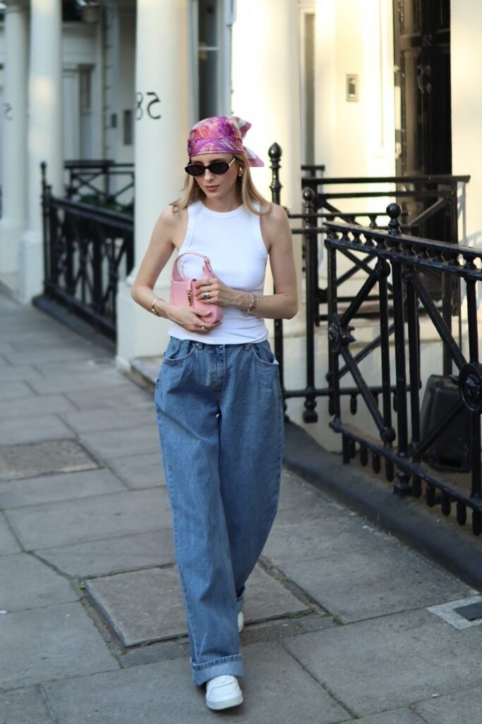 White Ribbed Tank Top + Pink Patterned Headscarf + Baggy Light-Wash Blue Jeans + White Sneakers