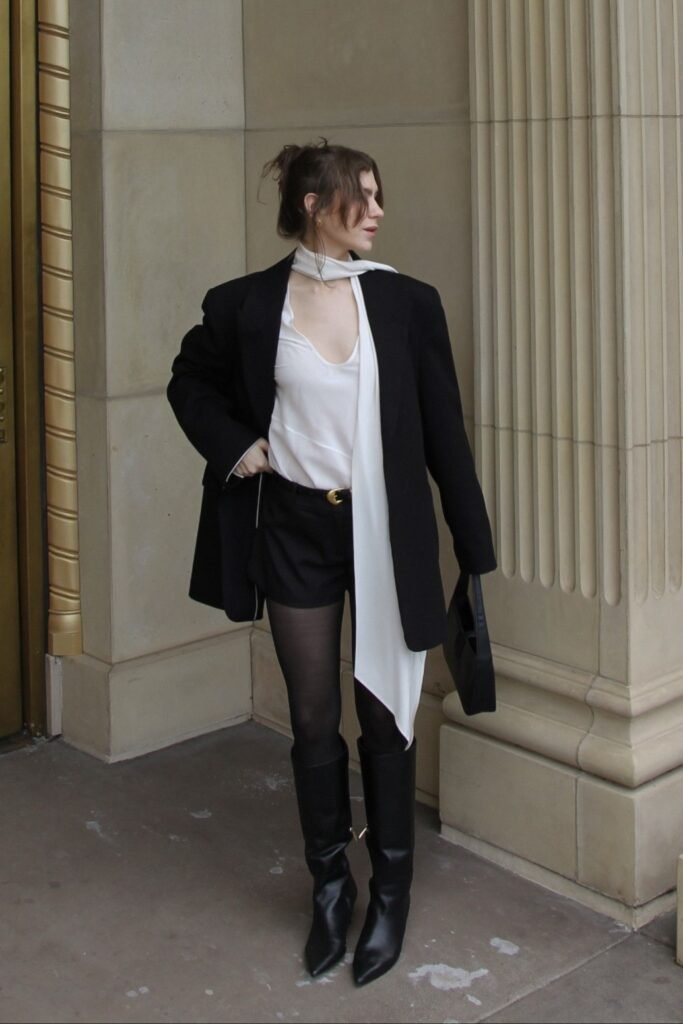 White Skinny Neck Scarf + Black Oversized Blazer + Black Mini Shorts + Black Knee-High Boots