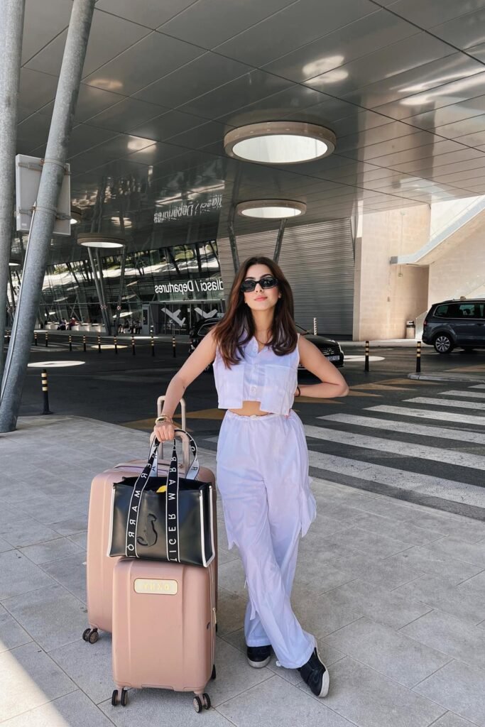 White Sleeveless Crop Top + White Cargo Trousers + Black Sneakers