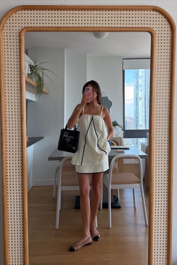 White Sleeveless Mini Dress with Black Piping + Black Prada Tote + Two-Tone Ballet Flats