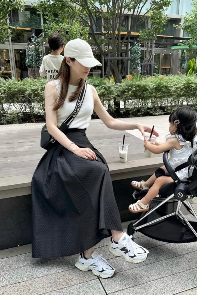 White Sleeveless Top + Black Quilted A-Line Skirt + White & Black Sneakers