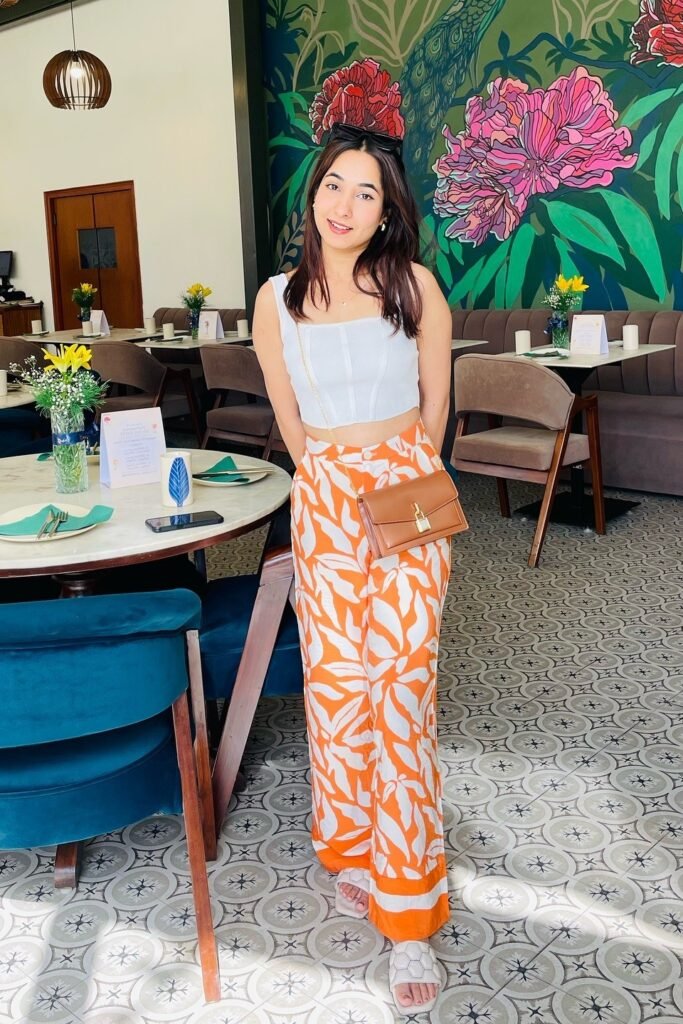 White Square-Neck Corset Top + Orange and White Leaf Print Wide-Leg Trousers + Tan Crossbody Bag + White Quilted Slides