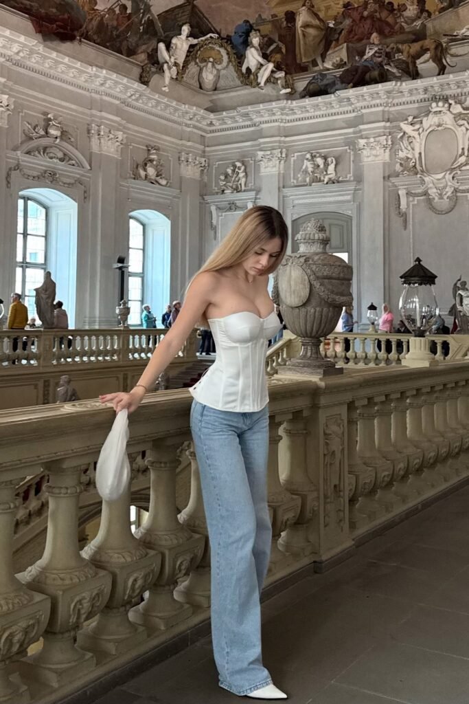 White Strapless Sweetheart Corset + Light Wash Wide-Leg Jeans + White Pointed-Toe Boots