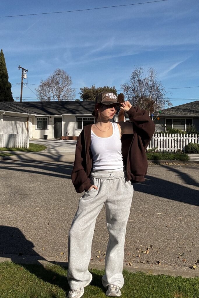 White Tank Top + Oversized Dark Brown Zip-Up Hoodie + Heather Grey Wide-Leg Sweatpants + White Retro Sneakers