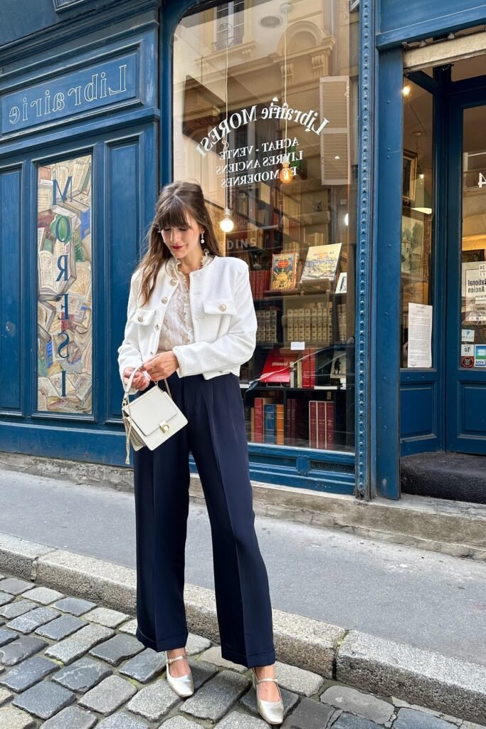 White Textured Cropped Jacket + Ruffled White Blouse + Navy Blue Wide-Leg Trousers + Silver Mary Jane Flats